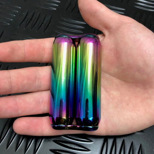Hand holding 180 gram hand roller fidget by Kaiko in Oil Slick Smooth
