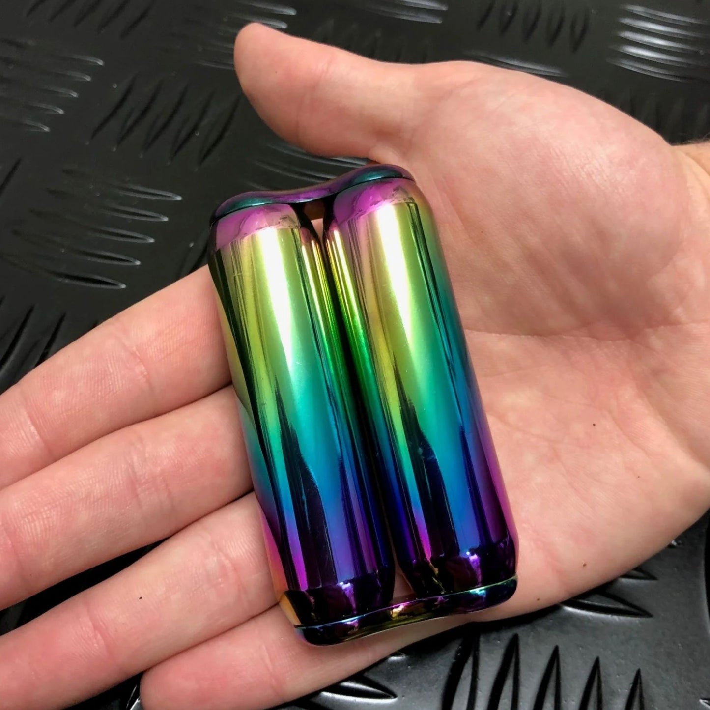 Hand holding 305gram hand roller by Kaiko in Smooth Oil Slick