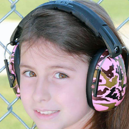 Child wearing Banz Hear No Blare Earmuffs Ear Defenders in Camo Pink