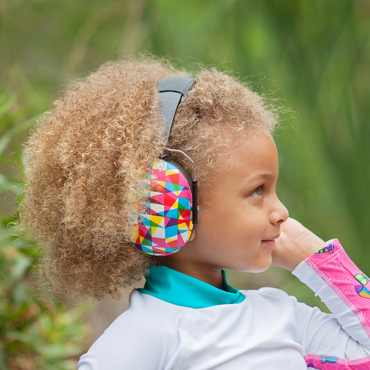Child wearing Banz Hear No Blare Earmuffs Ear Defenders in Geo