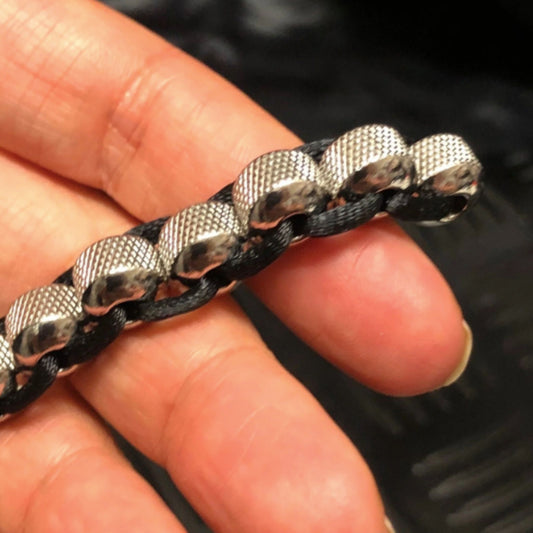 Hand holding Kaiko's Crunchy Hand Caterpillar Fidget