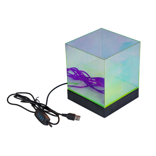 Transparent cube sensory lamp with USB cable on a white background