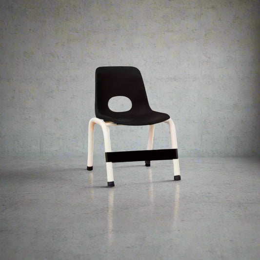 Black Sensory Chair Fidget Band on a black and white chair against a neutral background