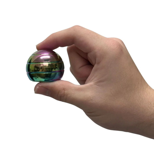 Hand holding Gyroscope Spinning Desktop Fidget by Kaiko in Oil Slick