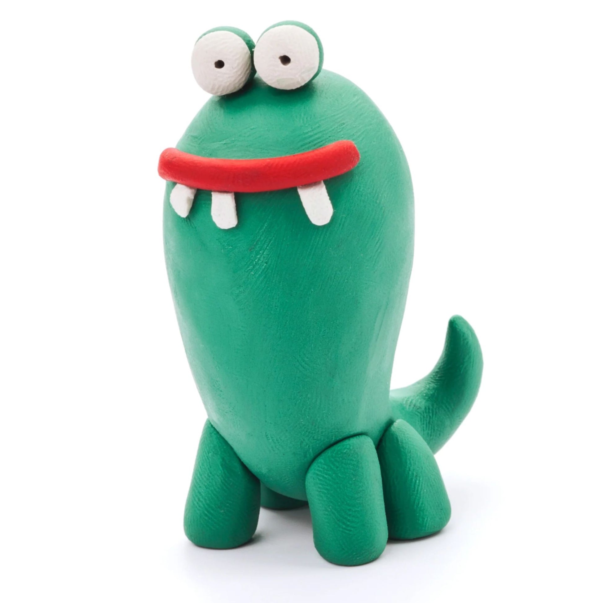 Green monster made of Hey Clay air-dry clay on a white background