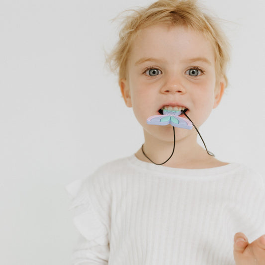 Girl chewing Jellystone Designs Chew Necklace in Mermaid