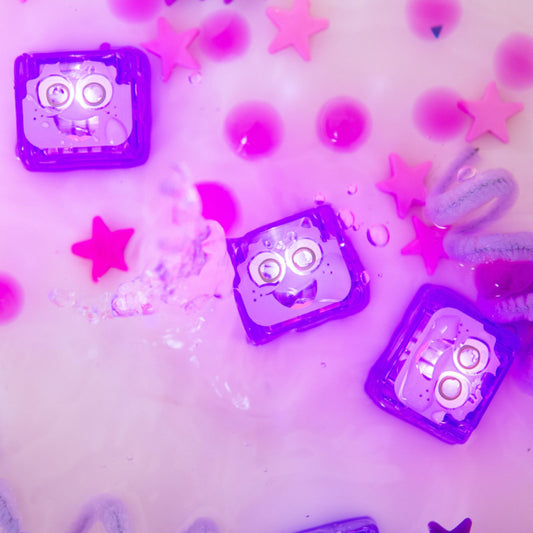 Jellystone Designs Glo Pal Cubes in Purple or Lumi glowing in water - Water-activated sensory lights for sensory play