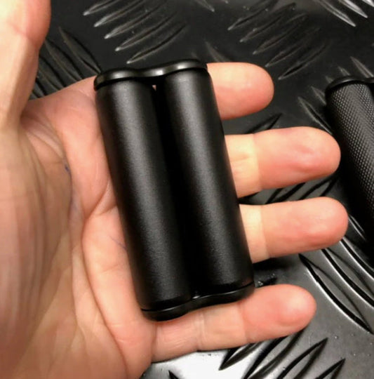 Person holding the Smooth Mini hand roller by Kaiko Fidgets in Black