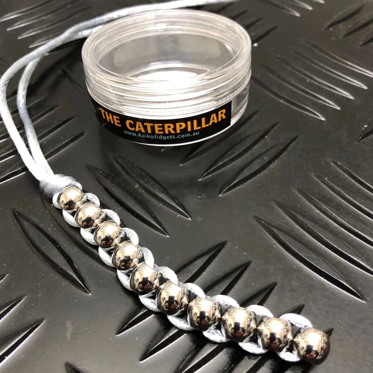 Hand Caterpillar Fidget by Kaiko in Silver with storage container