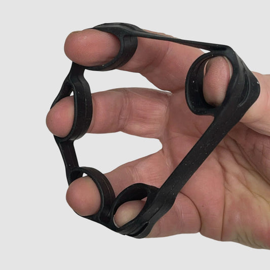 Hand using the Stretch Finger Grip in the Losing Your Sh!t Kit by Kaiko For Regulation and Improved Function