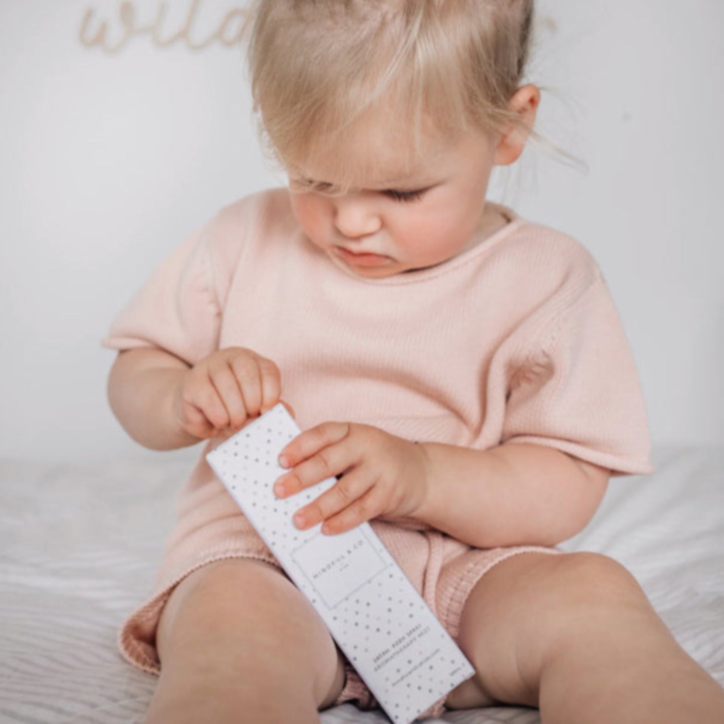 Child holding the Mindful & Co Kids Focus Aromatherapy Spray in its box