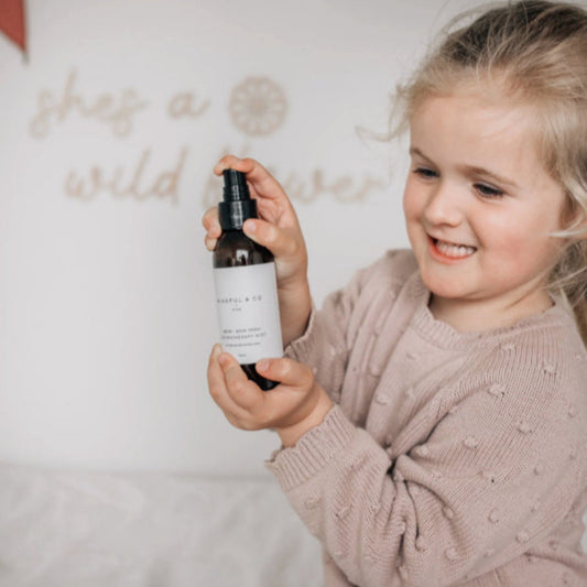 Child holding the Mindful & Co Kids Focus Aromatherapy Spray