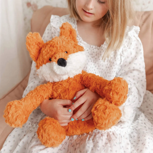 Girl holding a Mindful & Co Kids weighted stuffed animal - Frankl the Weighted Fox