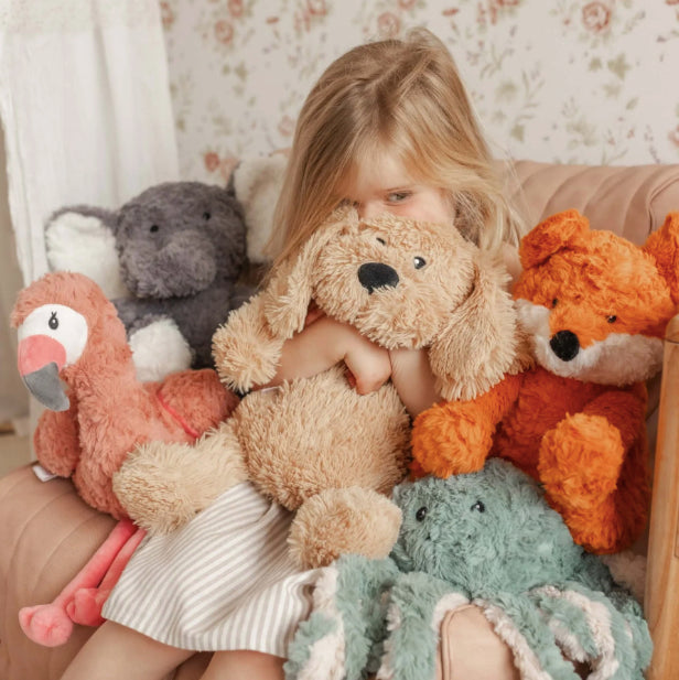 Child cuddllng Mindful & Co Kids weighted stuffed animals - Frankl the Weighted Fox, Eleanor the Weighted Elephant, Charlie the Weighted Dog