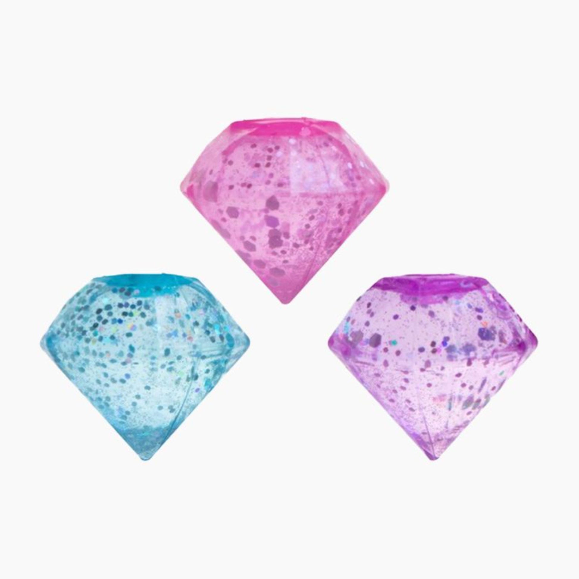 Blue, pink and purple NeeDoh Groovy Jewel diamond-shaped squishy ball with a glittery texture on a white background