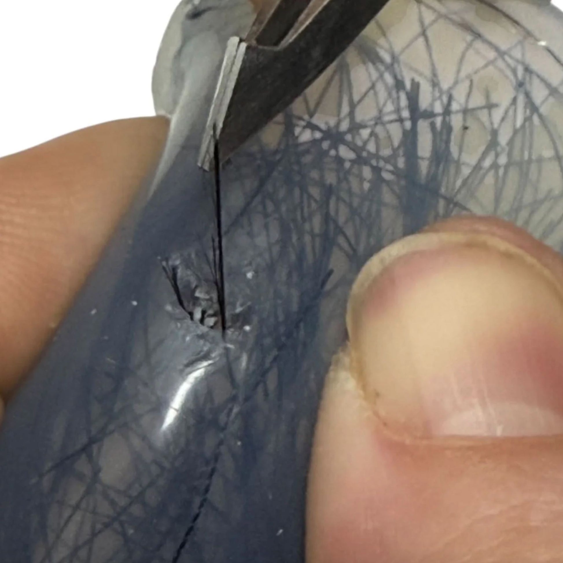 Close up of extraction from Pick Em Starter Set by Kaiko Picking, Popping & Hair Pulling Support Kit