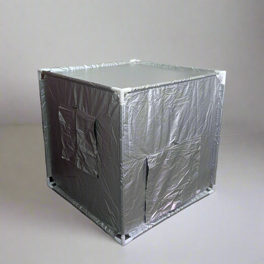 Silver Sensory Blackout Tent with closed door and window on grey background