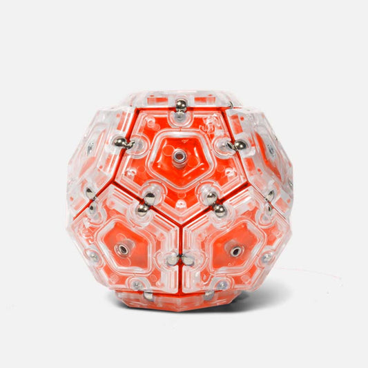 Geometric fidget magnet toy by Speks with red and clear design on a white background