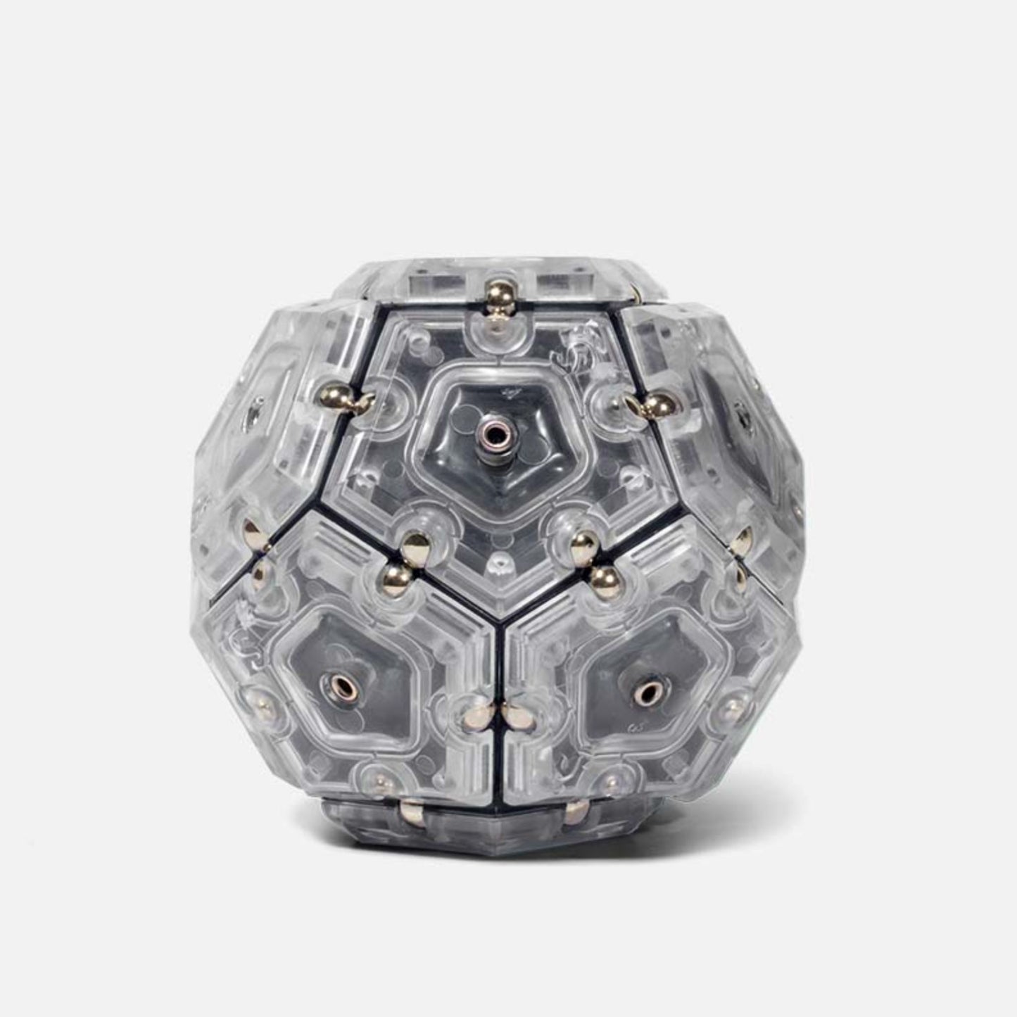 Speks Geode magnetic fidget sphere in grey and clear on a white background
