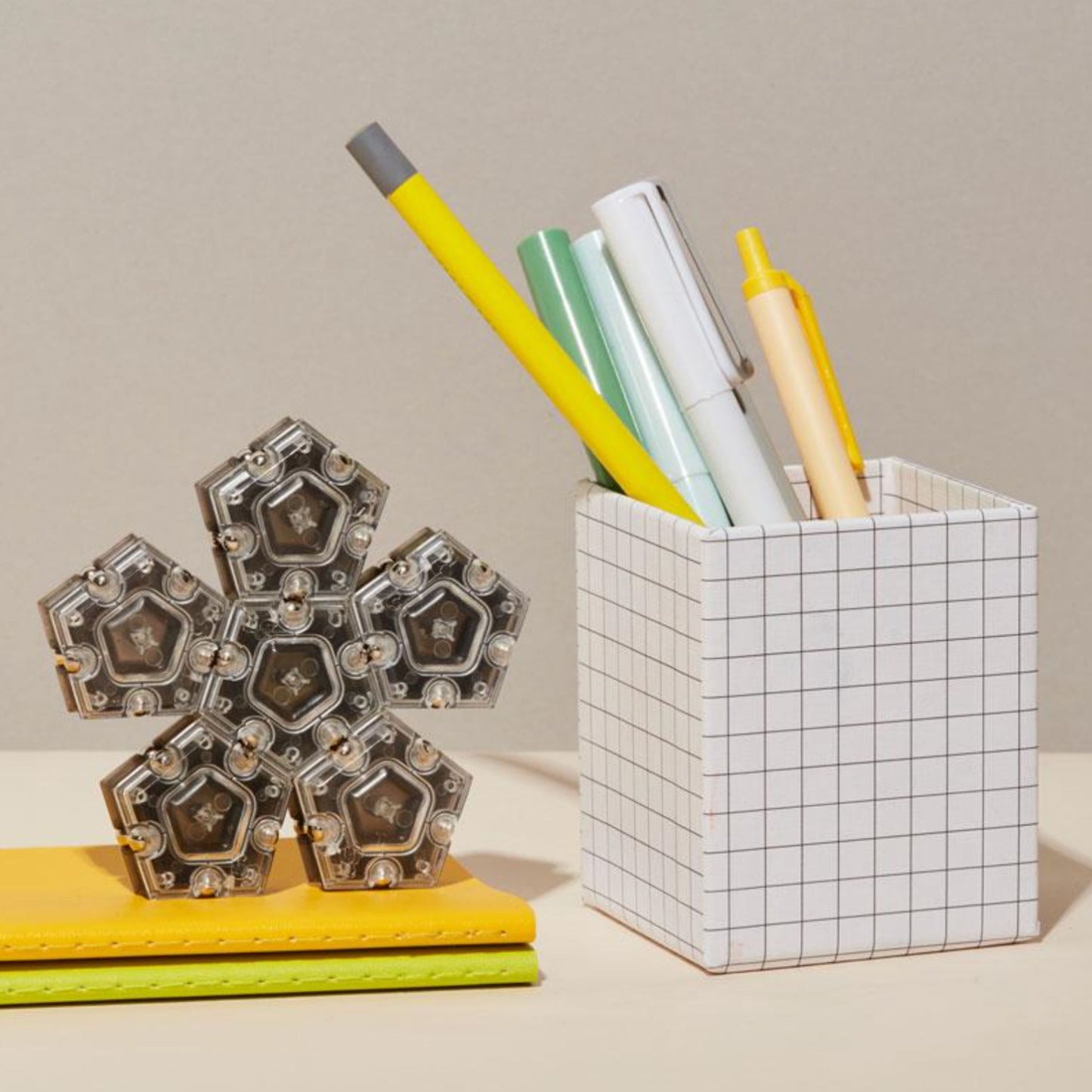 Speks Geode magnetic fidget in a snowflake structure on a desktop in an office setting