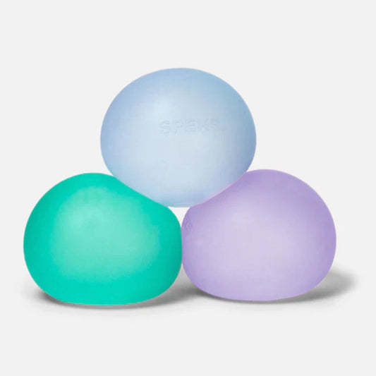 Three Speks Gump original-size squishy stress balls in green, blue and purple on a white background.