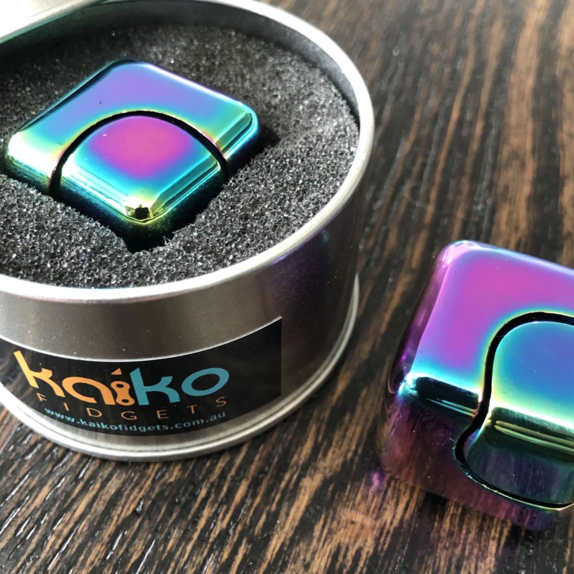 Close up of Square Spinning Cube by Kaiko in display tin