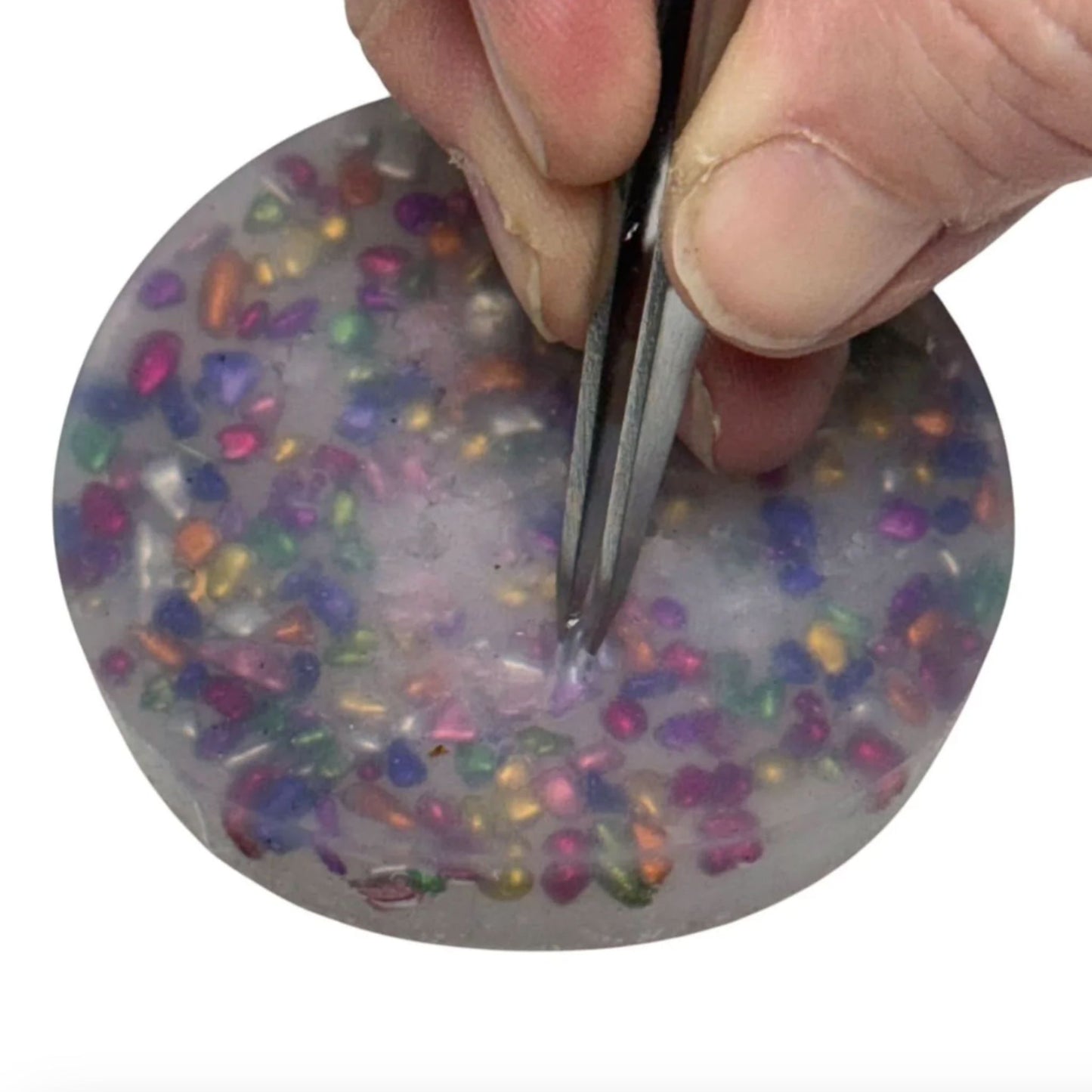 Tweezers picking out stones from Stone Pick Em Stack 3-Pack Refill Picking, Popping & Hair Pulling Support Kit