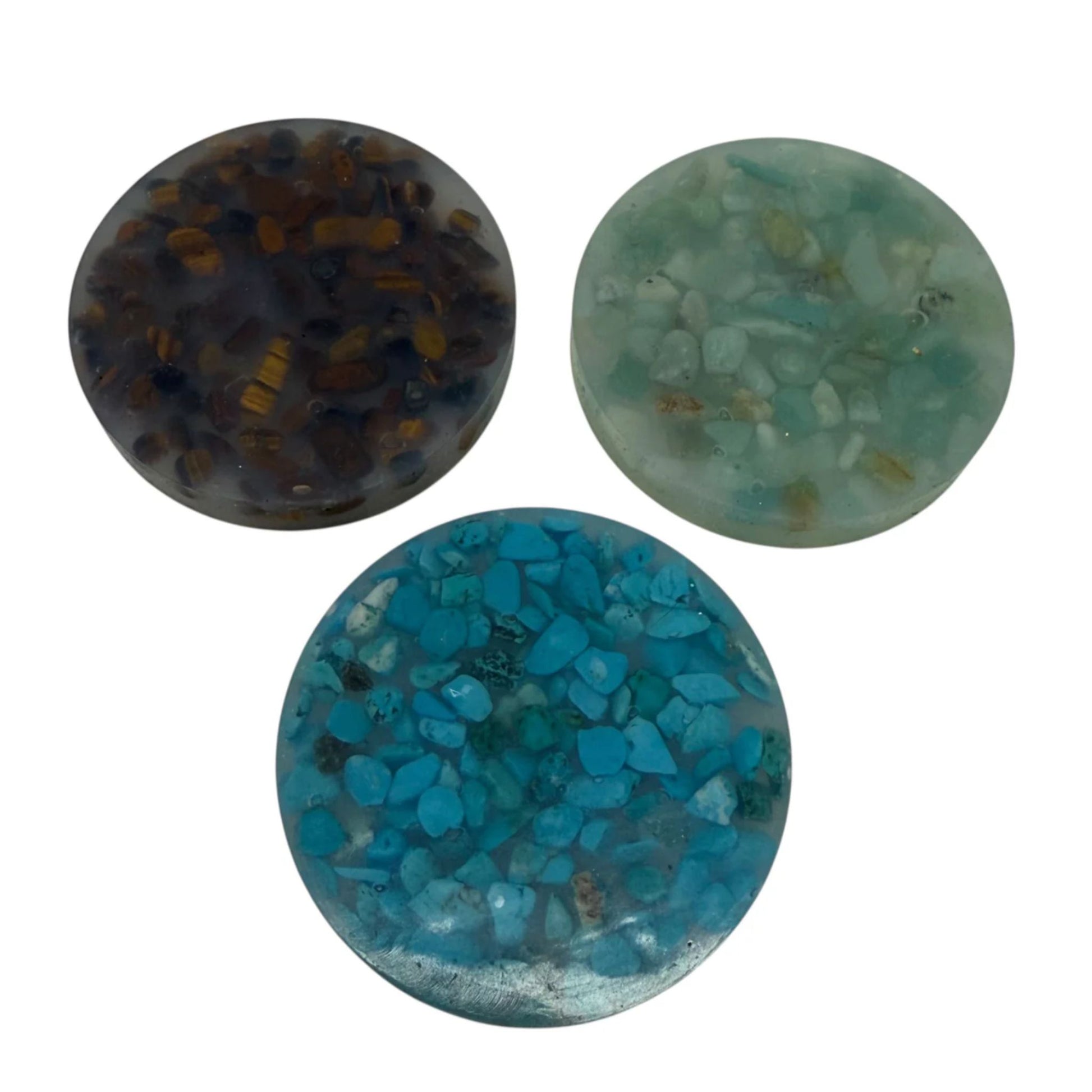 Three Kaiko turquoise crystals and stone silicone picky pads on a white background