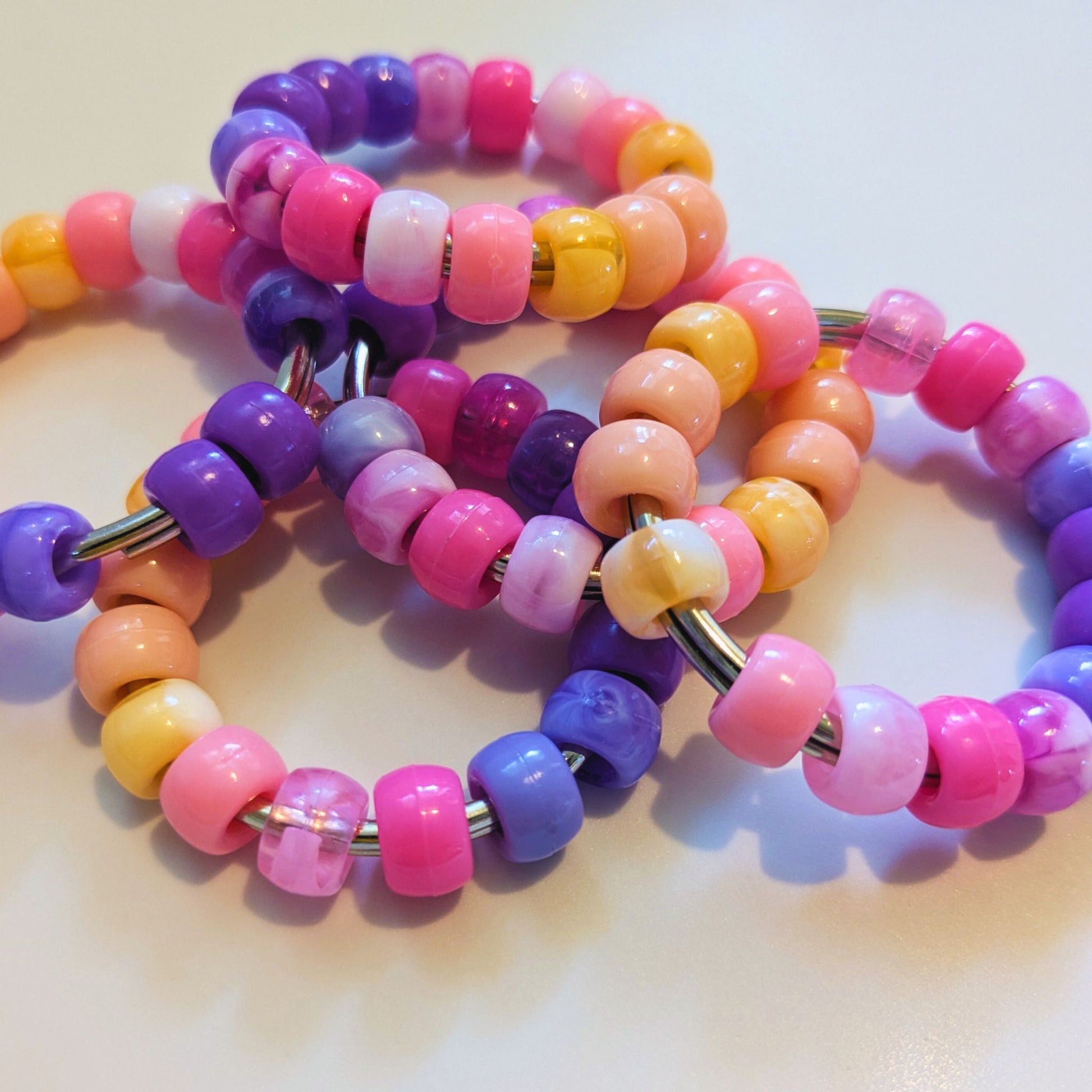 Pile of Sunset Swirl Roller Fidget by Tutti Frutti Fidgets