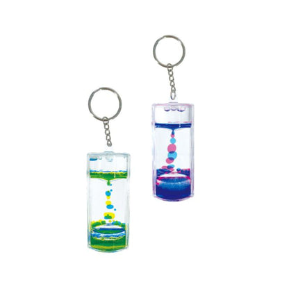Two keychains with colourful liquid inside on a white background