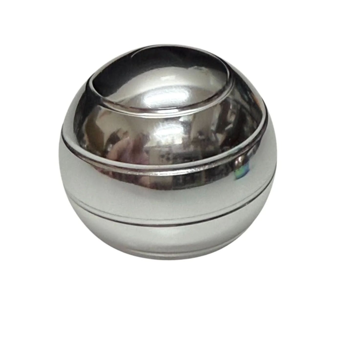 Silver metallic desktop spinning fidget against a white background