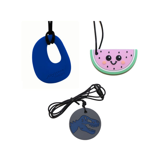 Three chew pendant necklaces with different designs on a white background