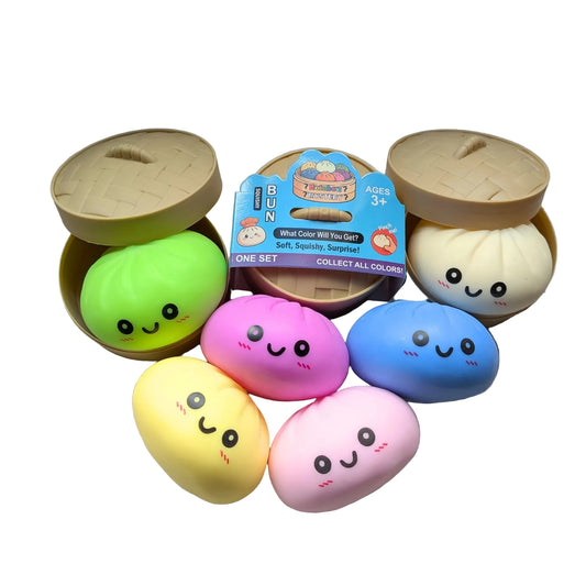 Set of colorful squishy toys with a packaging box on a white surface