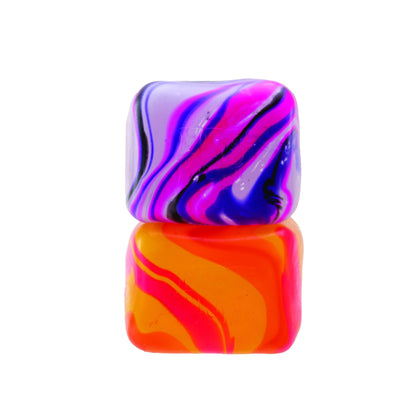 Two colourful Needoh Nice Cube Swirl marbled squishy cubes on a white background