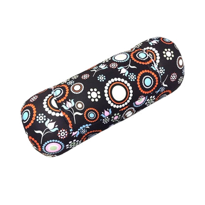 Decorative cylindrical vibrating pillow with floral pattern on a white background
