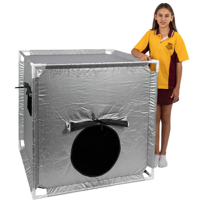 Child standing next to Sensory Blackout Tent