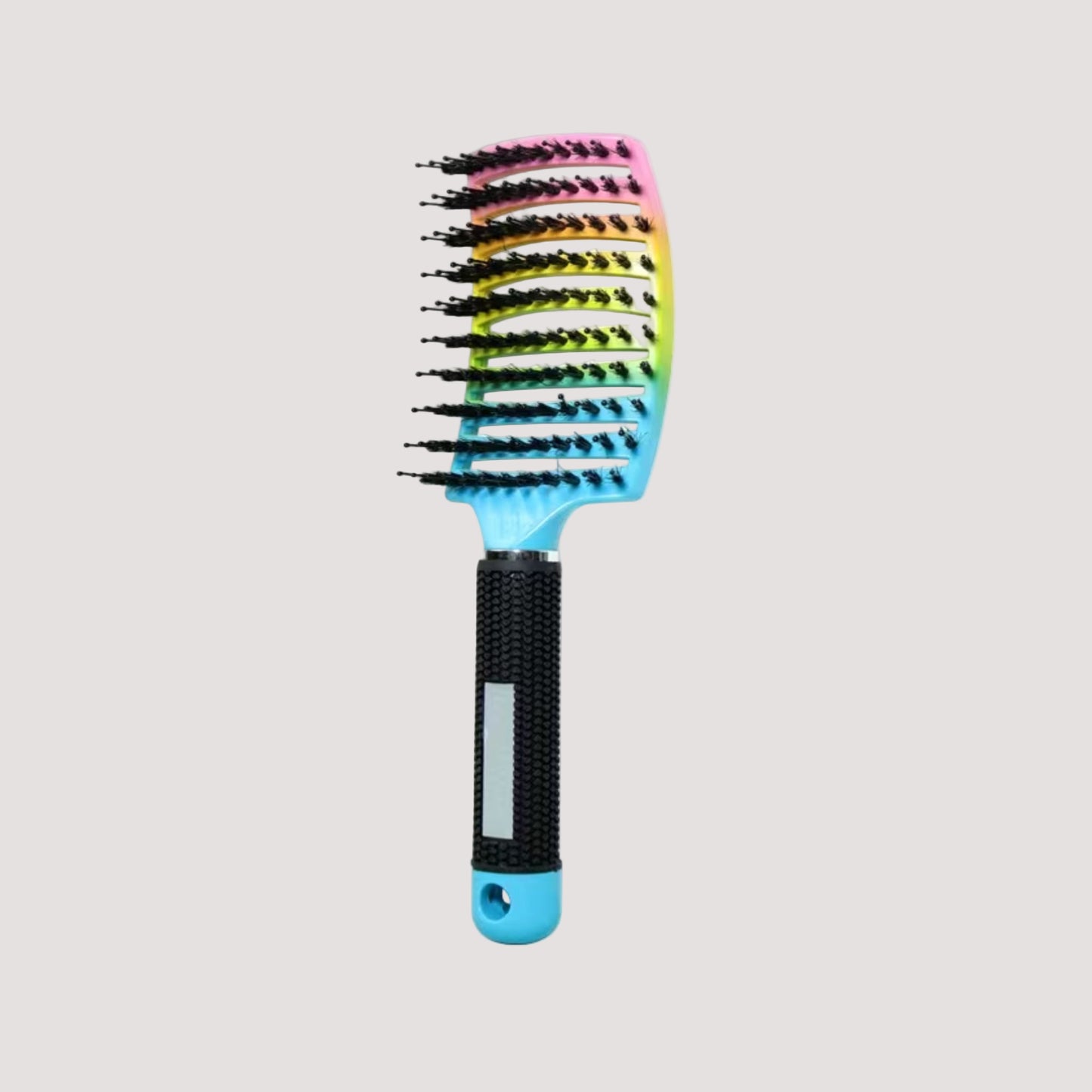 Multicoloured hairbrush for sensory sensitivities with gradient design on a white background