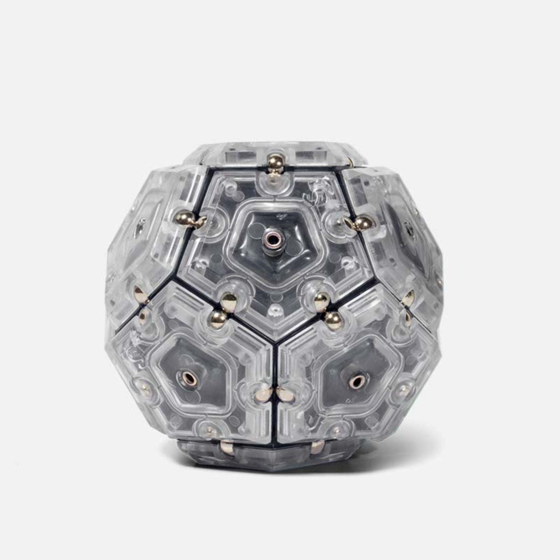 Speks Geode magnetic fidget sphere in grey and clear on a white background