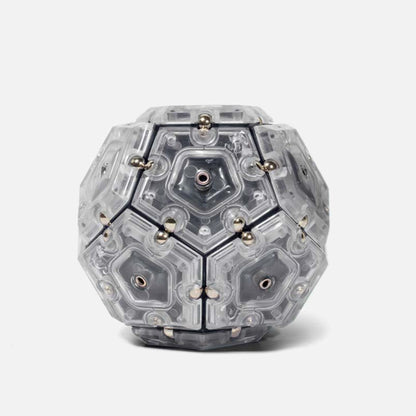 Speks Geode magnetic fidget sphere in grey and clear on a white background