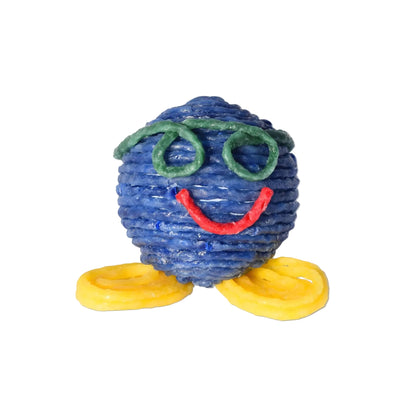 Colourful Wikki Stix  figure with a blue body, green hair, red smile, and yellow shoes on a white background